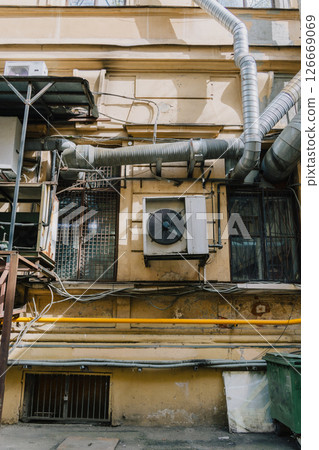 building with large air conditioner on wall. Ventilation air conditioning. cooling down in summer. 126669069