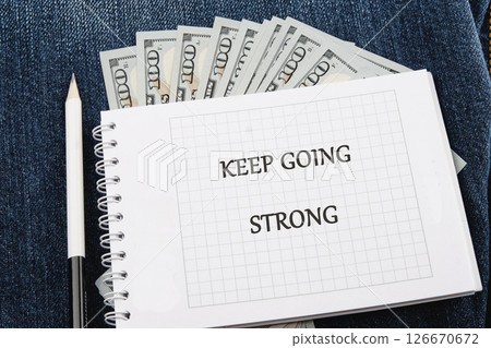 Business, motivation and keep moving forward concept. Copy space. Concept words KEEP GOING STRONG Business, motivation and keep moving forward concept. Copy space. Concept words KEEP GOING STRONG 126670672