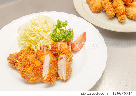 A view of the kitchen where tonkatsu is being made in a restaurant kitchen 126670714