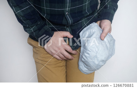 Incontinence pads for men. Urinary incontinence. Sanitary pads for men with problems of the genitourinary system. Urine leakage due to prostatitis or stress.  126670881
