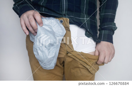 Incontinence pads for men. Urinary incontinence. Sanitary pads for men with problems of the genitourinary system. Urine leakage due to prostatitis or stress. Incontinence pads for men. Urinary incontinence. Sanitary pads for men with problems of the genitourinary system. Urine leakage due to prostatitis or stress. 126670884