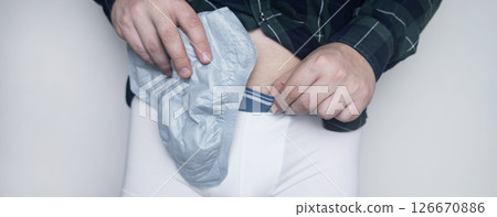 Incontinence pads for men. Urinary incontinence. Sanitary pads for men with problems of the genitourinary system. Urine leakage due to prostatitis or stress. Incontinence pads for men. Urinary incontinence. Sanitary pads for men with problems of the genitourinary system. Urine leakage due to prostatitis or stress. 126670886