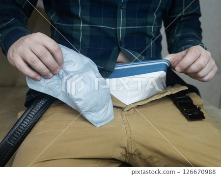 Incontinence pads for men. Urinary incontinence. Sanitary pads for men with problems of the genitourinary system. Urine leakage due to prostatitis or stress. Incontinence pads for men. Urinary incontinence. Sanitary pads for men with problems of the genitourinary system. Urine leakage due to prostatitis or stress. 126670988