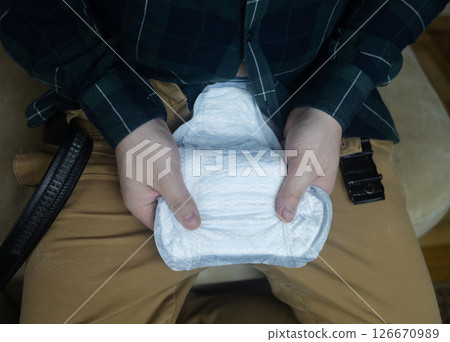 Incontinence pads for men. Urinary incontinence. Sanitary pads for men with problems of the genitourinary system. Urine leakage due to prostatitis or stress. Incontinence pads for men. Urinary incontinence. Sanitary pads for men with problems of the genitourinary system. Urine leakage due to prostatitis or stress. 126670989