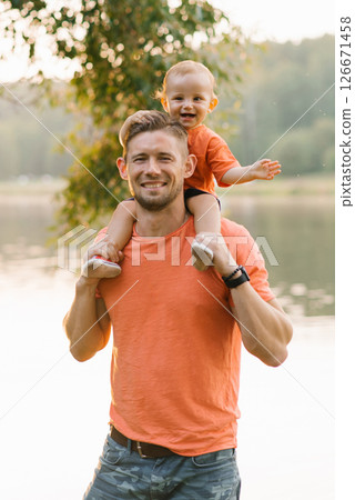 Happy Father Carrying Toddler Son Happy Father Carrying Toddler Son 126671458
