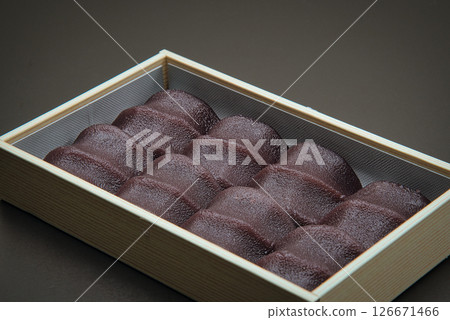 Enjoy this delicious Japanese confectionery, made of soft mochi wrapped in smooth bean paste, with some Japanese tea. Enjoy this delicious Japanese confectionery, made of soft mochi wrapped in smooth bean paste, with some Japanese tea. 126671466