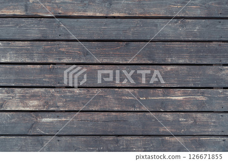 Aged wooden planks with rough texture and natural imperfections 126671855