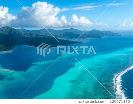Aerial view of Tahaa island, French Polynesia, with turquoise lagoon and reef Aerial view of Tahaa island, French Polynesia, with turquoise lagoon and reef 126671870