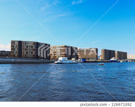 Modern Waterside Architecture Surrounded by a Beautiful Clear Blue Sky Above Us All 126671892