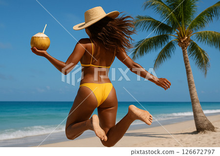 Woman jumping in yellow bikini on beach 126672797