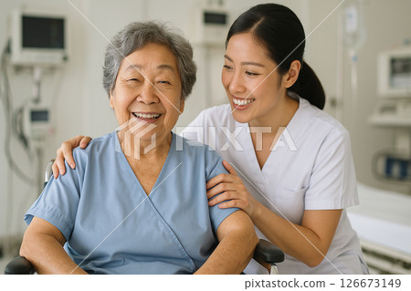 Asian elderly woman smiling with nurse in hospital 126673149