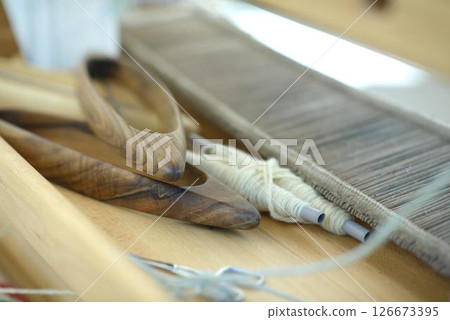 Handweaving Tools and Wool Yarn on Artisan Loom Handweaving Tools and Wool Yarn on Artisan Loom 126673395