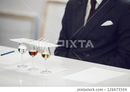 Sophisticated Spirits Tasting Event, Close up. Degustation Glasses with Various Untitled Alcoholic Drinks on the Table.  126673504