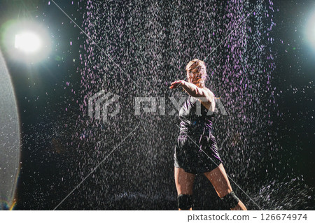 Contemporary woman dancer posing in rain water on black background. Female artist performer dancing with expression. Modern ballerina dancing in darkness. Passion dance in dark. Flexibility balance Contemporary woman dancer posing in rain water on black background. Female artist performer dancing with expression. Modern ballerina dancing in darkness. Passion dance in dark. Flexibility balance 126674974