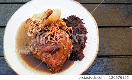 Roasted duck leg with dumpling, red cabbage and gravy, traditional czech cuisine copy space 126676565