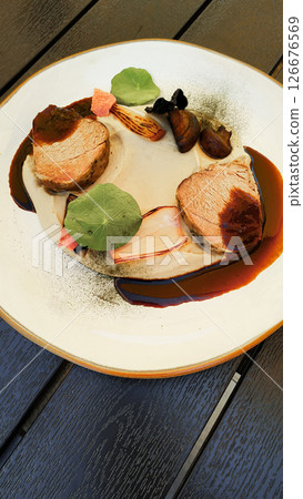 Delicious pork tenderloin with creamy sauce and mushrooms, gourmet dish at cervena lhota castle Delicious pork tenderloin with creamy sauce and mushrooms, gourmet dish at cervena lhota castle 126676569