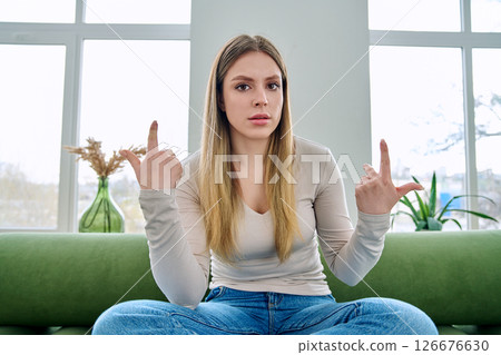 Web cam view of young serious woman talking looking in camera, online meeting, video call Web cam view of young serious woman talking looking in camera, online meeting, video call 126676630