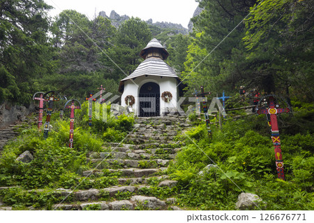 Symbolic Cemetery with Colorful Crosses Leading to a Chapel in Vysoke Tatry, Slovakia 126676771