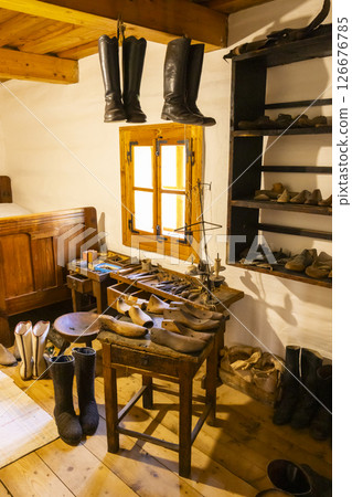 Old shoemaker workshop in Pribylina, Slovakia, displaying tools, lasts, and boots, preserving traditional craftsmanship Old shoemaker workshop in Pribylina, Slovakia, displaying tools, lasts, and boots, preserving traditional craftsmanship 126676785
