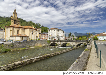 River Salat flowing through Seix in Ariege, France, featuring the church and the town hall 126676851