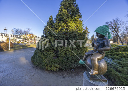Statue of boy sitting with a fish, symbol of Frantiskovy lazne spa, UNESCO World Heritage Site, Western Bohemia, Czech Republic Statue of boy sitting with a fish, symbol of Frantiskovy lazne spa, UNESCO World Heritage Site, Western Bohemia, Czech Republic 126676915