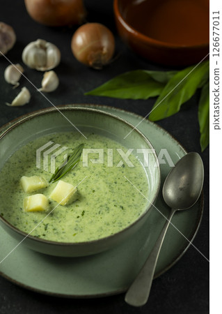 Soup of wild garlic, potatoes, onions and cream Soup of wild garlic, potatoes, onions and cream 126677011