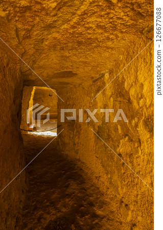 Interior of a tholos tomb showing corbelled dome and columns in Carmona, Spain 126677088