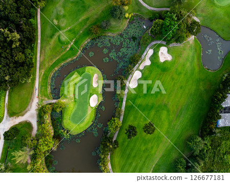 Aerial view drone shot of beautiful green golf field fairway and putting green Top down image for sport background and travel nature background Amazing view. 126677181
