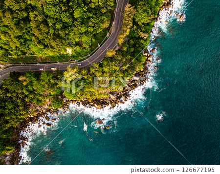 Top view sea surface nature background,Big waves crashing on rocks seascape background. Top view sea surface nature background,Big waves crashing on rocks seascape background. 126677195