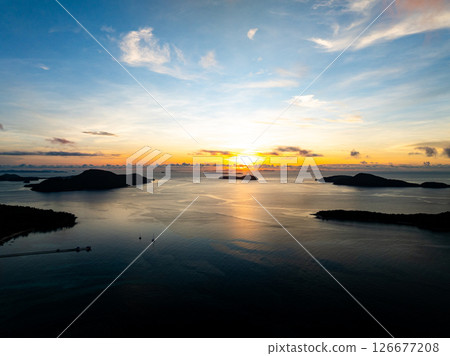 Aerial view sunset sky,Nature beautiful light Sunset or sunrise over sea,Colorful scenery sunset sky background,Amazing clouds and waves in sunrise sky nature light cloud background. 126677208