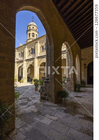 Baeza Cathedral rising above cloister arches in Andalusia, Spain 126677359