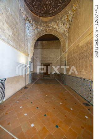 Exploring the Alhambra Palace, intricate moorish architecture and tilework in Granada, Spain Exploring the Alhambra Palace, intricate moorish architecture and tilework in Granada, Spain 126677413