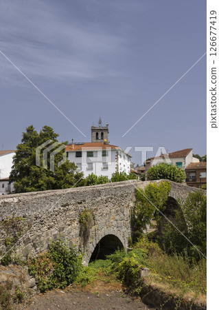 Ancient stone bridge crossing a small stream in Arenas de San Pedro, Spain Ancient stone bridge crossing a small stream in Arenas de San Pedro, Spain 126677419