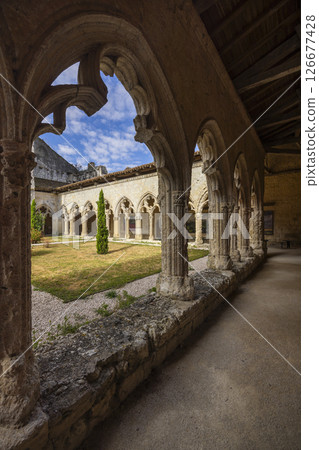 Cloister of La Romieu Collegiate Church framing courtyard view in France 126677428