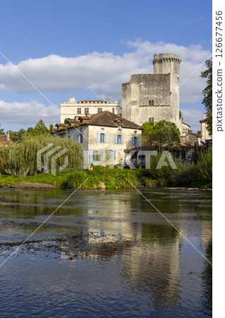 Bourdeilles Castle reflecting on Dronne River in Dordogne, France 126677456