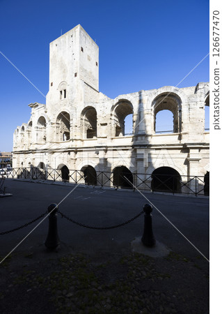Arles Amphitheater standing tall under blue sky in Provence, France 126677470