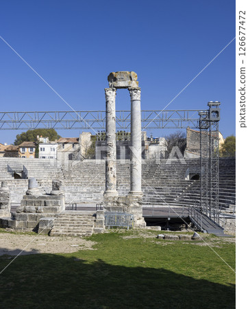 Ancient roman theater of Arles showing standing columns and bleachers Ancient roman theater of Arles showing standing columns and bleachers 126677472