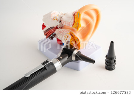 Otoscope with model for audiologist or ENT doctor use otoscope checking ear and treat hearing loss problem. Otoscope with model for audiologist or ENT doctor use otoscope checking ear and treat hearing loss problem. 126677583
