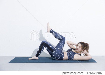 Woman doing muscle training 126677907