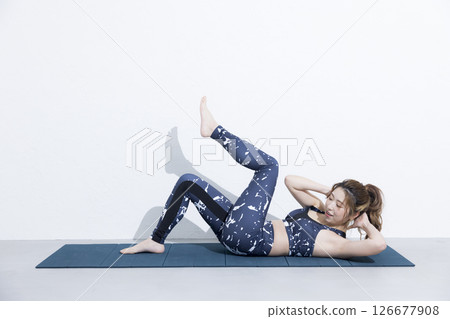 Woman doing muscle training 126677908