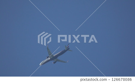Airplane Flight Sky: Commercial Jet Airliner Ascending Clear Blue Sky Daytime Travel 126678086
