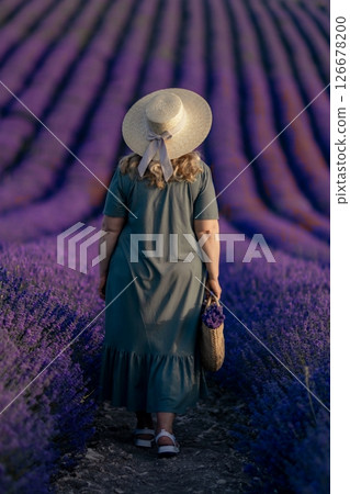 A woman wearing a straw hat 126678200