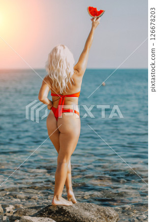 Woman Red Bikini Beach Summer: Oceanside photoshoot, celebrating summer joy, showcasing swimwear. Woman Red Bikini Beach Summer: Oceanside photoshoot, celebrating summer joy, showcasing swimwear. 126678203