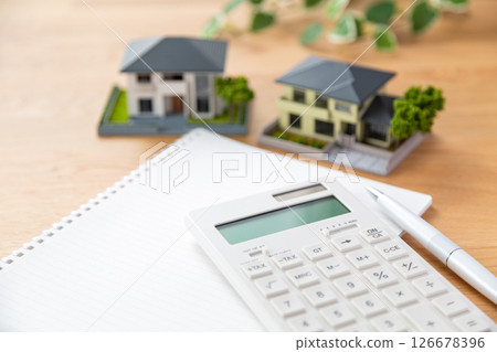 House model, calculator and notebook House model, calculator and notebook 126678396