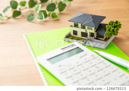 House model, calculator and notebook House model, calculator and notebook 126678523
