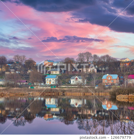 Dramatic sunset over the lake. Dramatic sunset over the lake. 126679779