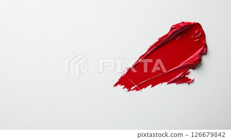 Red lipstick smear on a white background creating a romantic mood for valentine's day, women's day, or spring, symbolizing love and passion Red lipstick smear on a white background creating a romantic mood for valentine's day, women's day, or spring, symbolizing love and passion 126679842