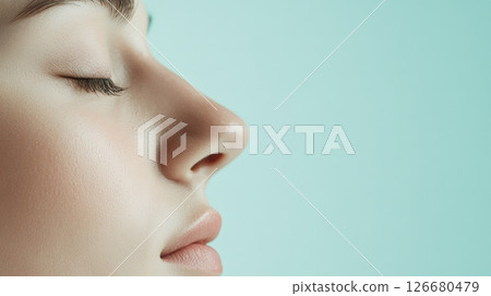 Profile of a young woman breathing with closed eyes, showing her perfect nose after rhinoplasty surgery, a concept of cosmetology and beauty 126680479