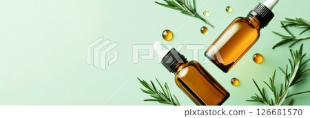 Two amber glass dropper bottles of rosemary essential oil float on a pastel green background, surrounded by fresh rosemary sprigs and oil droplets, creating a serene and natural wellness scene Two amber glass dropper bottles of rosemary essential oil float on a pastel green background, surrounded by fresh rosemary sprigs and oil droplets, creating a serene and natural wellness scene 126681570