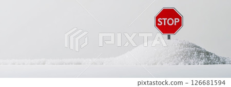 Conceptual image representing sugar addiction and dangers of excessive sugar intake with a stop sign planted on a pile of sugar, promoting a sugar free or low sugar lifestyle for better health 126681594